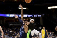 Memphis Grizzlies guard Ja Morant (12) is fouled by Minnesota Timberwolves guard Patrick Beverley in the second half of an NBA basketball game, Monday, Nov. 8, 2021, in Memphis, Tenn. (AP Photo/Brandon Dill)
