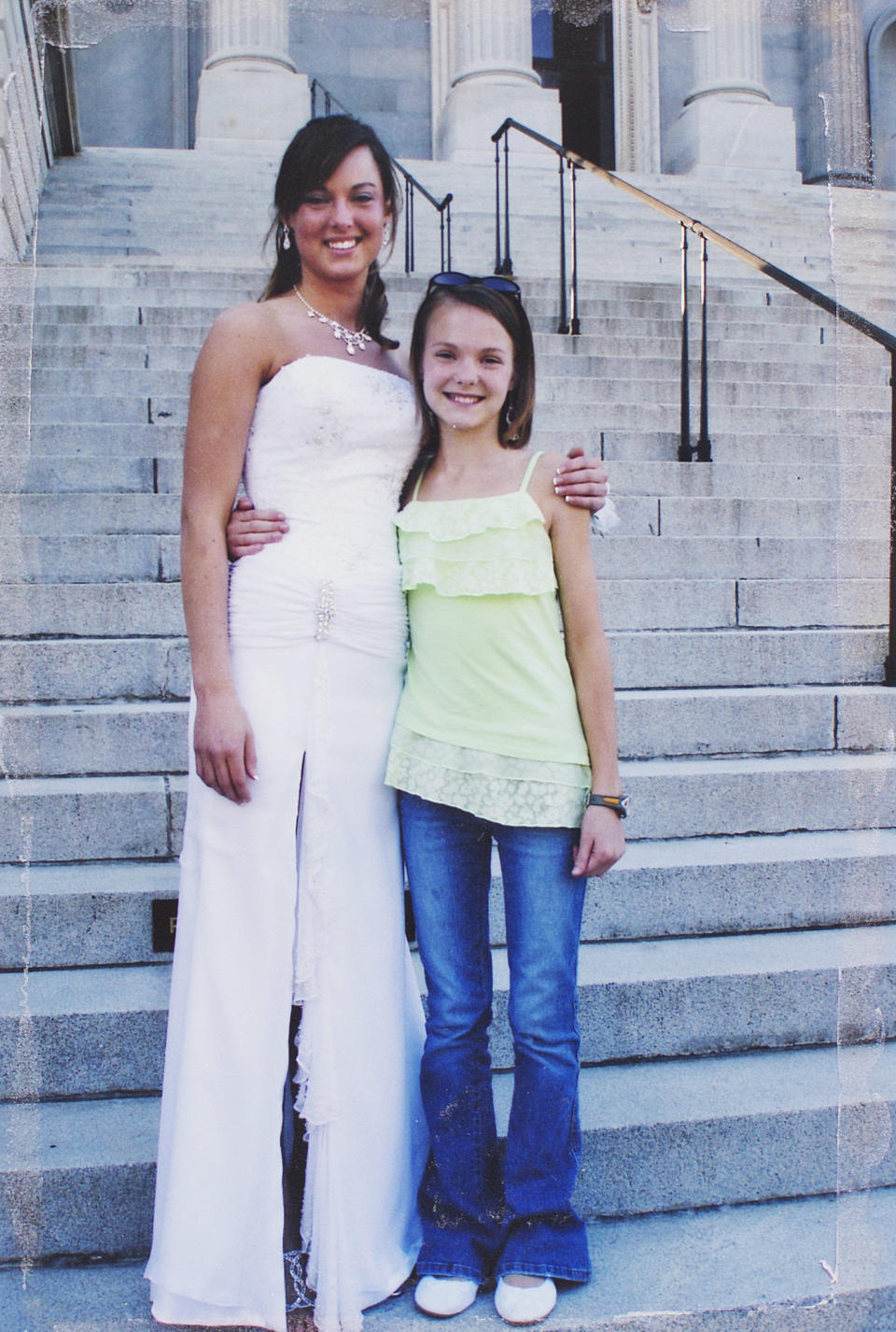 This 2005 photo provided Wednesday, April 9, 2014 by the Jones family is of Sarah Jones, left, on the day of her high school prom with her sister Rebecca. Sarah Jones, a 27-year-old camera assistant, was killed Feb. 20 by a freight train while filming a movie in southeast Georgia. (AP Photo/Courtesy of the Jones Family)