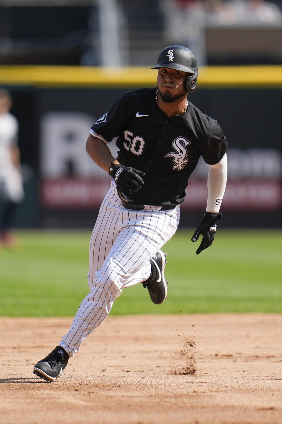 Chicago White Sox's Lenyn Sosa runs the bases on his way to score on an RBI double by Andrew Benintendi during the second inning of the second baseball game of a doubleheader against the Minnesota Twins, Wednesday, July 10, 2024, in Chicago. (AP Photo/Erin Hooley)