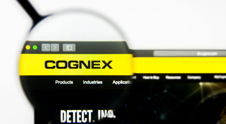 CGNX stock website homepage. Cognex Corporation logo visible on display screen.