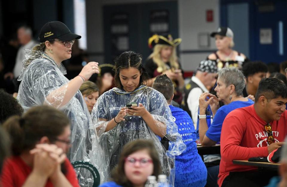 De Soto Parade participants found shelter in the Manatee High cafeteria as a rain band made its way through the area. Parade organizer still plan to have the parade, just delaying the start until 7:45.