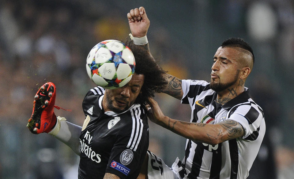 Football - Juventus v Real Madrid - UEFA Champions League Semi Final First Leg - Juventus Stadium, Turin, Italy - 5/5/15 Real Madrid's Marcelo in action with Juventus' Arturo Vidal Reuters / Giorgio Perottino