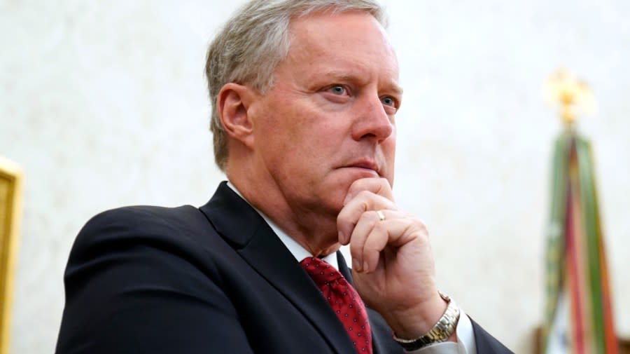 Chief of Staff Mark Meadows listens as President Donald Trump speaks in the Oval Office of the White House on Sept. 11, 2020, in Washington. (AP Photo/Andrew Harnik, File)
