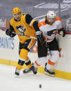 Pittsburgh Penguins' Cody Ceci (4) and Philadelphia Flyers' Jakub Voracek chase the puck during the second period of an NHL hockey game Thursday, March 4, 2021, in Pittsburgh. (AP Photo/Keith Srakocic)