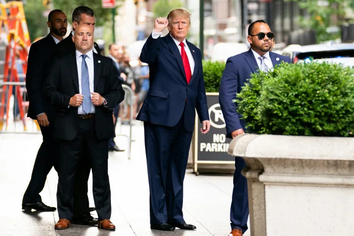 Former President Donald Trump gestures as he departs Trump Tower, Wednesday, Aug. 10, 2022, in New York, on his way to the New York attorney general's office for a deposition in a civil investigation.