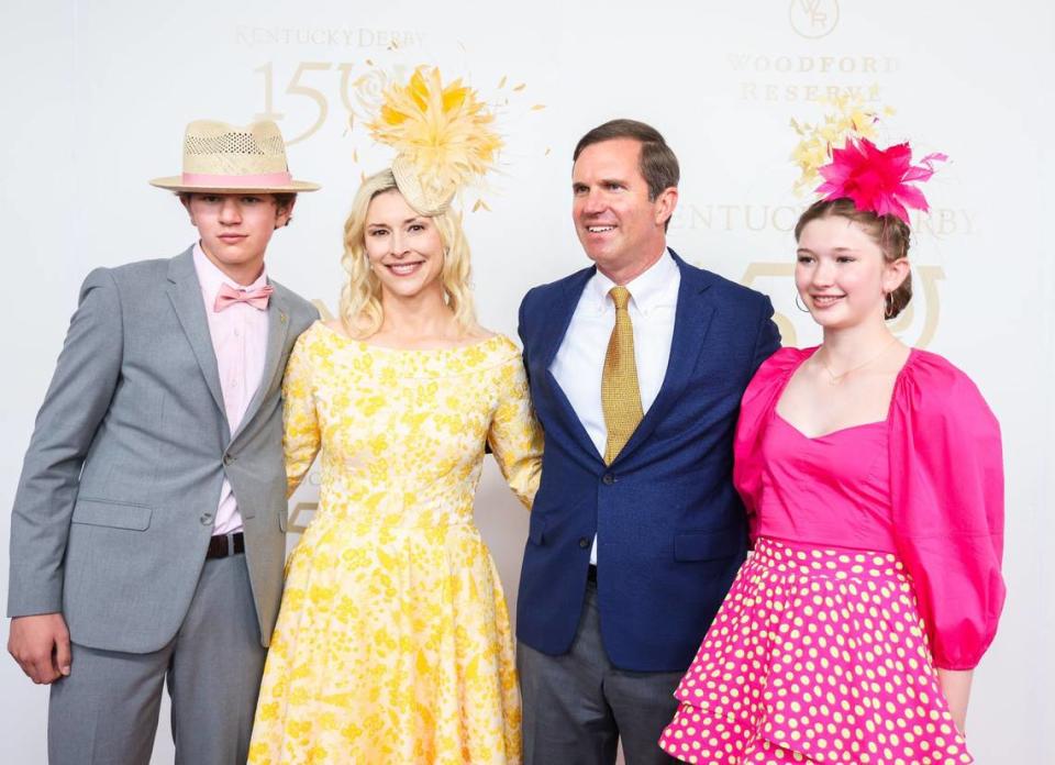 Gov. Andy Beshear and his family pose for a photo on the red carpet at the Kentucky Derby on Saturday, May 4, 2024, at Churchill Downs in Louisville, Kentucky.
