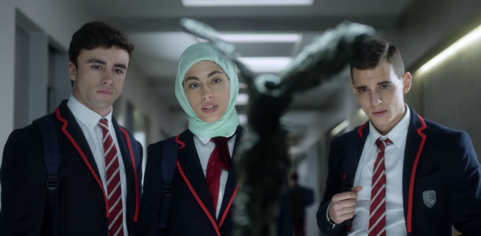 three students in uniform