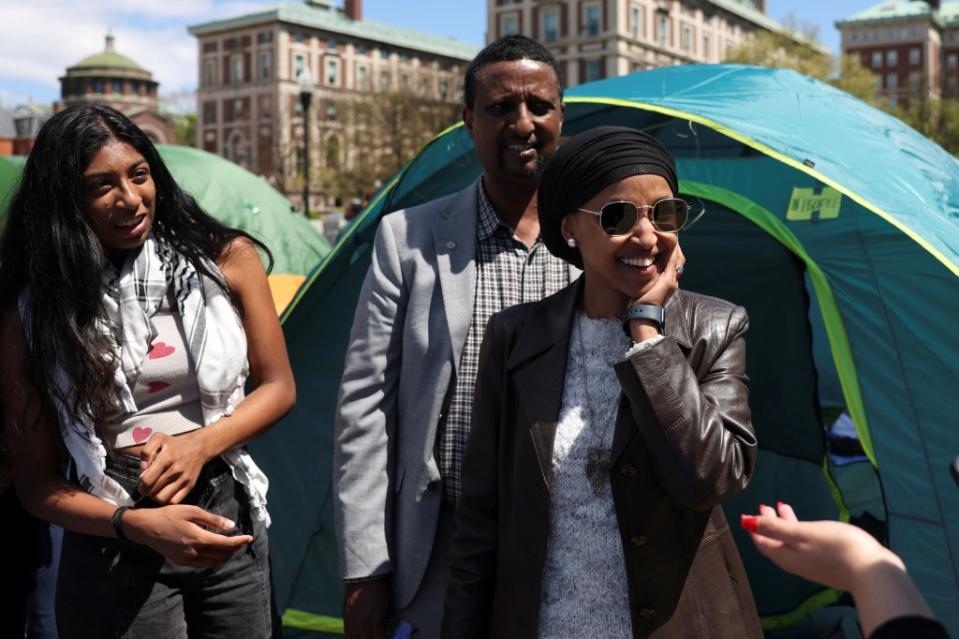 Rep. Ilhan Omar (D-Minn.) was spotted smiling at the anti-Israel encampment at Columbia University. REUTERS