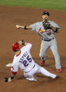 ARLINGTON, TX - OCTOBER 23: Rafael Furcal #15 of the St. Louis Cardinals turns the double play as Mike Napoli #25 of the Texas Rangers slides into second base in the eighth inning during Game Four of the MLB World Series at Rangers Ballpark in Arlington on October 23, 2011 in Arlington, Texas. (Photo by Doug Pensinger/Getty Images)