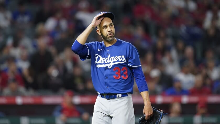 Los Angeles Dodgers' David Price (33) returns to the dugout during a spring training baseball game against the Los Angeles Angels in Anaheim, Calif., Monday, April 4, 2022. (AP Photo/Ashley Landis)