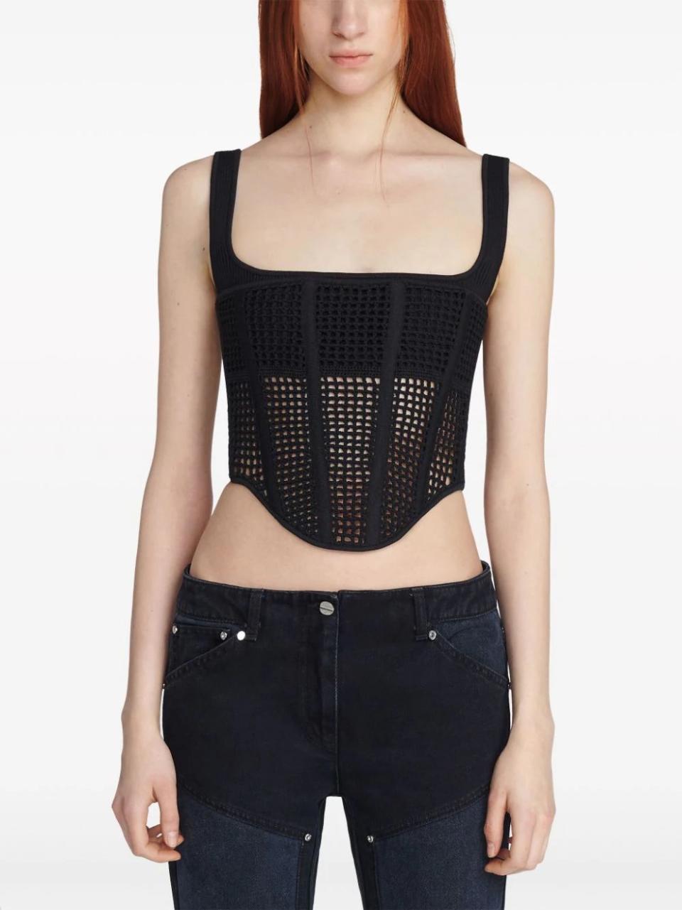 model wearing black crochet top with jeans