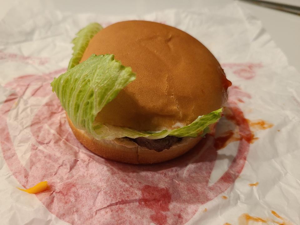 wendys jr cheeseburger deluxe on white and red wrapper