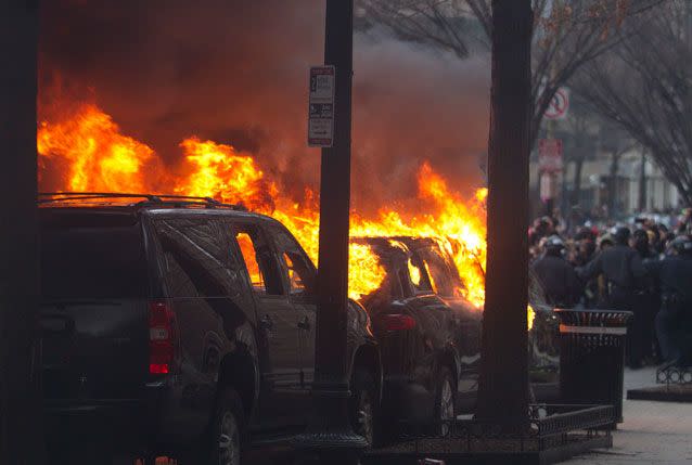 A car is torched in downtown DC. Source: AP