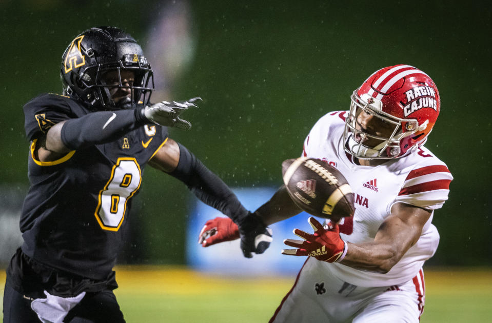 Louisiana-Lafayette wide receiver Kyren Lacy (2) misses a reception under coverage from Appalachian State defensive back Shemar Jean-Charles (8) during an NCAA college football game Friday, Dec. 4, 2020, in Boone, N.C. (Andrew Dye/The Winston-Salem Journal via AP, Pool)