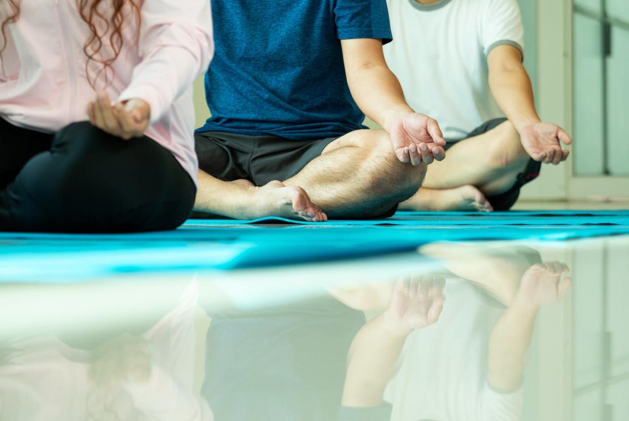<span class="caption">The meditation market is expected to grow to over $2 billion by 2022.</span> <span class="attribution"><a class="link " href="https://www.gettyimages.com/detail/photo/close-up-mudra-hand-of-threee-asian-men-and-woman-royalty-free-image/1323205967?adppopup=true" rel="nofollow noopener" target="_blank" data-ylk="slk:MR-MENG/Getty Images;elm:context_link;itc:0;sec:content-canvas">MR-MENG/Getty Images</a></span>