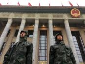 Chinese soldiers stand guard outside the Great Hall of the People before the opening of the 19th National Congress of the Communist Party of China at the Great Hall of the People in Beijing, China October 18, 2017. REUTERS/Jason Lee