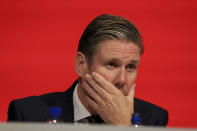 Labour shadow Brexit secretary Keir Starmer gestures, during the Labour Party's annual conference at the Arena and Convention Centre, in Liverpool, England, Tuesday Sept. 25, 2018. Starmer said the party would reject a deal along the lines May is proposing because it does not meet "six tests" it has set, including protecting workers' rights and retaining access to European markets. (Peter Byrne/PA via AP)