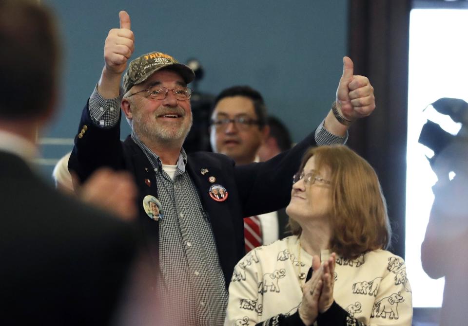 FILE - Electoral College elector John Haggard reacts after Gov. Rick Snyder announced all 16 of Michigan's electoral votes for President-elect Donald Trump, Monday, Dec. 19, 2016 in Lansing, Mich. Michigan Attorney General Dana Nessel has charged 16 Republicans Tuesday, July 18, 2023, with multiple felonies after they are alleged to have submitted false certificates stating they were the state’s presidential electors despite Joe Biden’s 154,000-vote victory in 2020. The group includes Republican National Committeewoman Kathy Berden, Meshawn Maddock, former co-chair of the Michigan Republican Party, and Haggard. (AP Photo/Carlos Osorio, File)