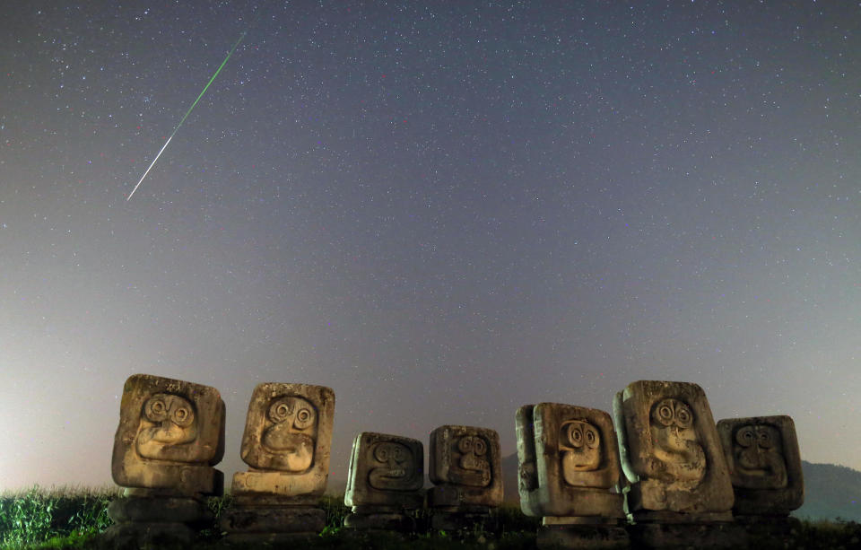 Meteors streak past the Necropolis on Smrike in Novi Travnik, Bosnia and Herzegovina on August 13, 2020. / Credit: DADO RUVIC / REUTERS