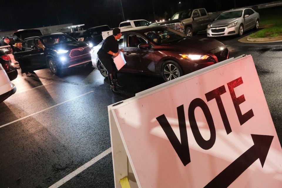Mar 5, 2024; Tuscaloosa, Alabama, USA; Camisha Thomas-Shabazz collects the ballots from poll workers as they arrive at the Beasor B. Walker Law Enforcement Center in Tuscaloosa. Elections officials gathered at that location to examine, verify, and post the returns from Tuscaloosa County’s voting precincts.