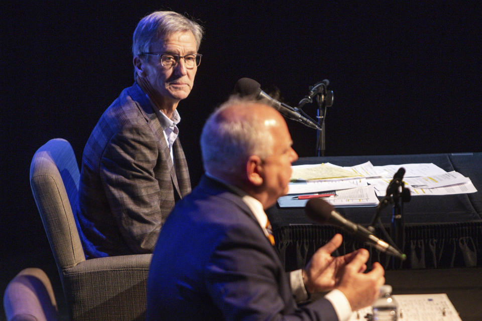 Incumbent Governor Tim Walz and gubernatorial candidate Scott Jensen engage in the third and final gubernatorial debate at the Fitzgerald Theater Friday, Oct. 28, 2022, in St. Paul. (AP Photo/Nicole Neri)