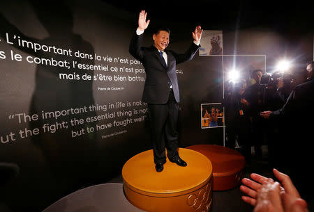 FILE PHOTO: Chinese President Xi Jinping stands on the podium of the Sydney 2000 Olympic Games during a visit with IOC President Thomas Bach at the Olympic Museum in Lausanne, Switzerland January 18, 2017. REUTERS/Denis Balibouse/File Photo