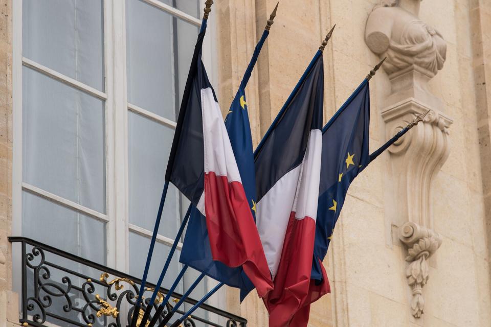 The French and European flags at the entrance to the Elysée Palace,