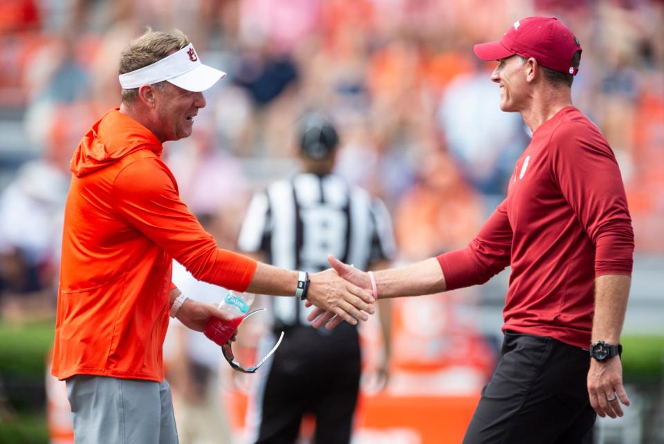 Auburn Tigers head coach Hugh Freeze and Oklahoma Sooners head coach Brent Venables shake hands during warm ups before Auburn Tigers take on Oklahoma Sooners at Jordan-Hare Stadium in Auburn, Ala., on Saturday, Sept. 28, 2024.