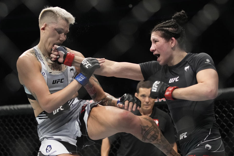 Irene Aldana hits Macy Chiasson in a 140-pound catchweight bout during the UFC 279 mixed martial arts event Saturday, Sept. 10, 2022, in Las Vegas. (AP Photo/John Locher)