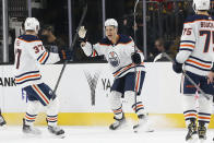 Edmonton Oilers right wing Jesse Puljujarvi, center, celebrates his goal against the Vegas Golden Knights during the second period of an NHL hockey game Saturday, Nov. 27, 2021, in Las Vegas. (AP Photo/Chase Stevens)