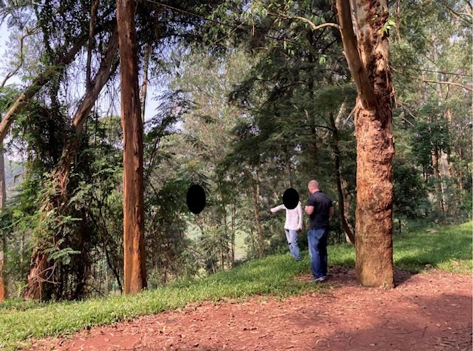 A former member of genocidal youth militia Interahamwe points out a location where Eric Nshimiye, the Ohio engineer arrested this month, allegedly killed a 14-year-old boy during the Rwandan genocide (Department of Homeland Security)