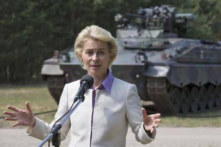 German Defence Minister Ursula von der Leyen speaks to media in front of infantry fighting vehicle Marder during a visit to the 41st mechanized infantry brigade in Viereck, Germany, July 16, 2015. REUTERS/Axel Schmidt