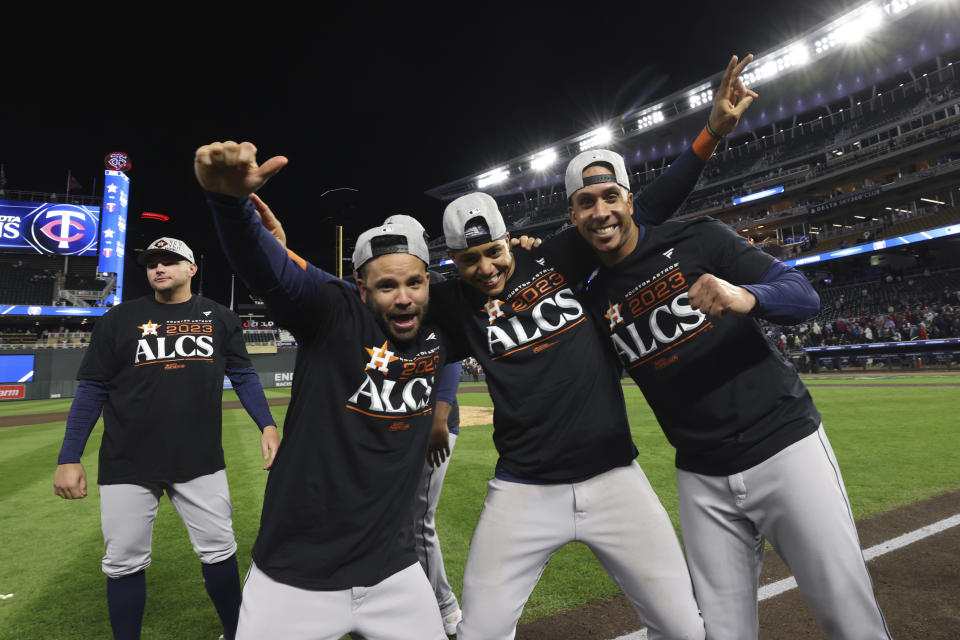 Houston Astros players celebrate on the field after defeating the Minnesota Twins in Game 4 to win a baseball AL Division Series, Wednesday, Oct. 11, 2023, in Minneapolis. (AP Photo/Stacy Bengs)