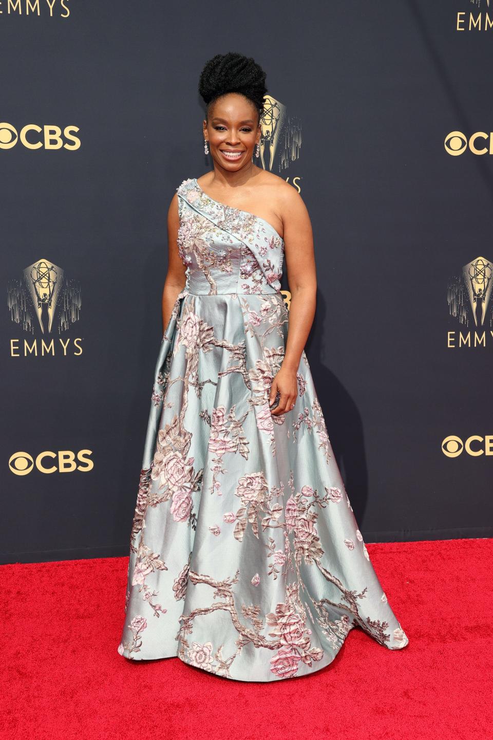 Amber Ruffin wears a one-strap dress on the Emmys red carpet.