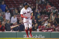 Boston Red Sox's Xander Bogaerts watches the flight of his two-run home run in the eighth inning of a baseball game against the Houston Astros, Monday, May 16, 2022, in Boston. The Red Sox won 6-3. (AP Photo/Steven Senne)