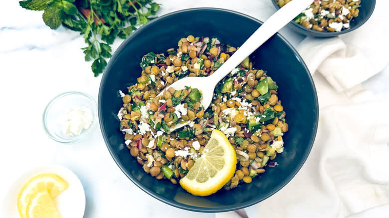 lentil salad in black bowl