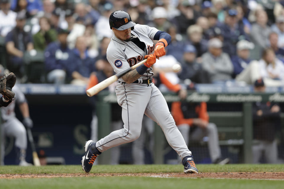 Detroit Tigers' Javier Baez hits an RBI single against the Seattle Mariners during fifth inning of a baseball game, Wednesday, Oct. 5, 2022, in Seattle. (AP Photo/John Froschauer)