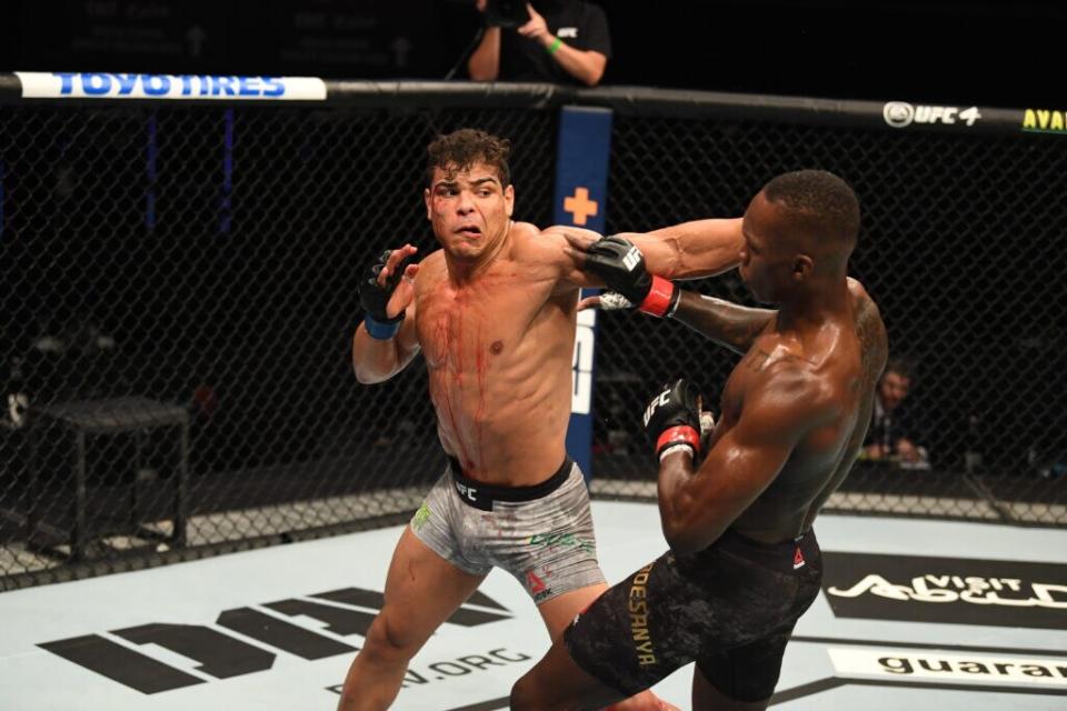 Paulo Costa of Brazil punches Israel Adesanya of Nigeria in their middleweight championship bout during UFC 253 inside Flash Forum on UFC Fight Island on September 27, 2020 in Abu Dhabi, United Arab Emirates. (Photo by Josh Hedges/Zuffa LLC via Getty Images)