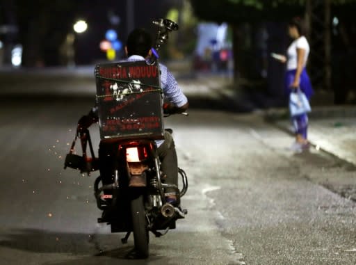 A water pipe delivery man heads to find his customers at a in the coastal city of Byblos north of Beirut