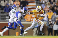 Tennessee running back Ty Chandler (8) tries to get away from Florida defenders during the second half of NCAA college football game Saturday, Dec. 5, 2020, in Knoxville, Tenn. (Randy Sartin/Knoxville News Sentinel via AP, Pool)