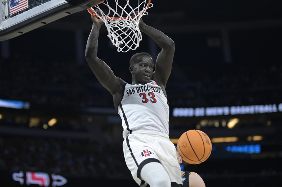 San Diego State forward Aguek Arop (33) dunks during the second half of a first-round college basketball game against Charleston in the NCAA Tournament, Thursday, March 16, 2023, in Orlando, Fla. (AP Photo/Phelan M. Ebenhack)