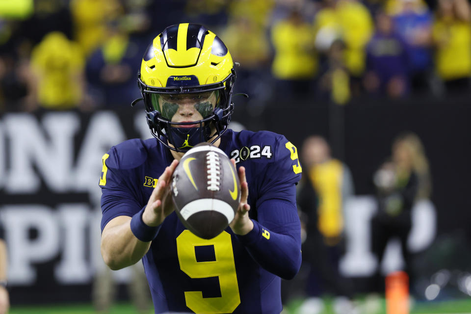 HOUSTON, TEXAS - JANUARY 8: J.J. McCarthy #9 of the Michigan Wolverines warms up prior to the CFP National Championship game at NRG Stadium on January 8, 2024 in Houston, Texas. (Photo by CFP/Getty Images)