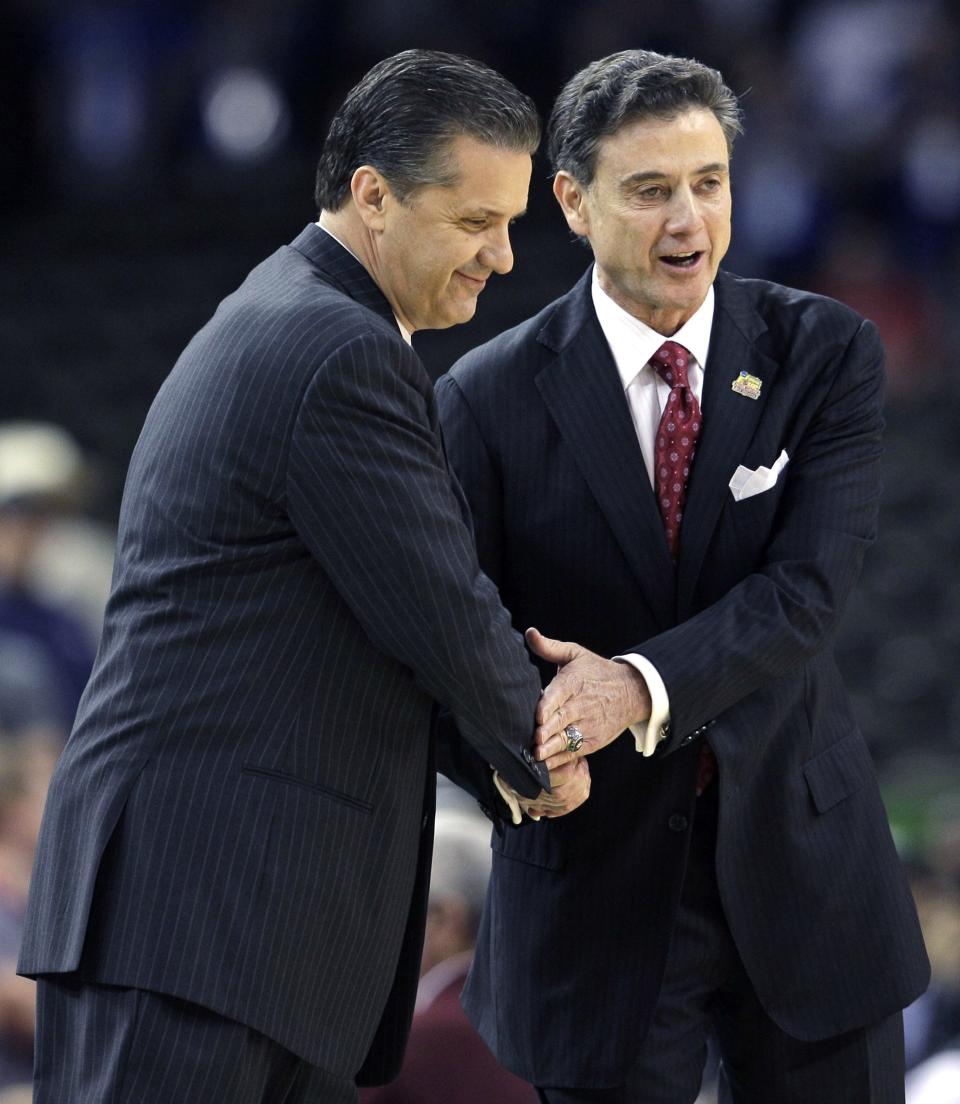 In this file photo, then-Louisville head coach Rick Pitino (right) shakes hands with Kentucky head coach John Calipari (left) before the first half of a Final Four game in New Orleans. The pair are two of the winningest coaches in the Wildcats' illustrious history.