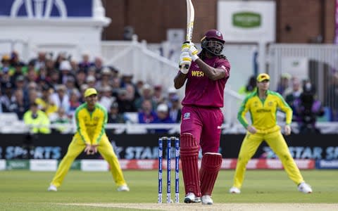 Chris Gayle of West Indies watches his shot sail to the boundary - Credit: Getty Images