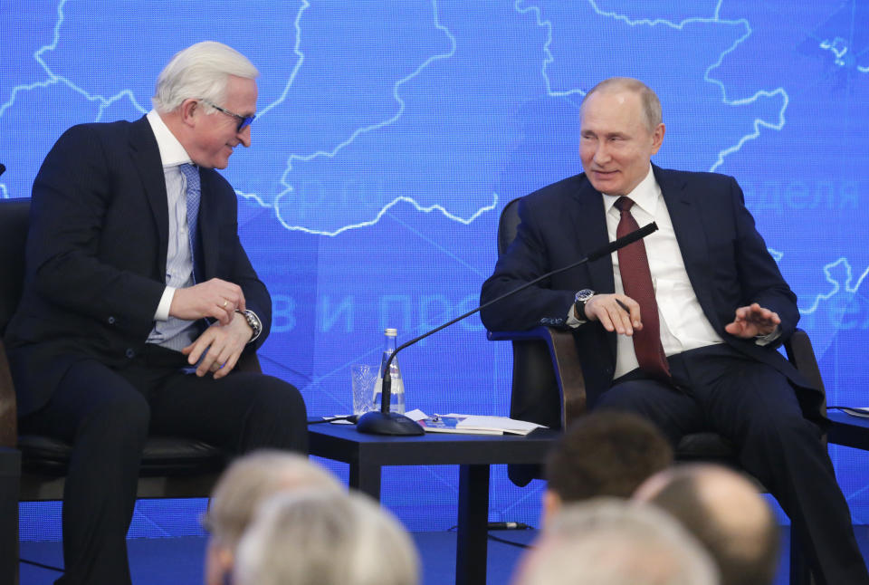 Russian President Vladimir Putin, right, and head of the Russian Union of Industrialists and Entrepreneurs Alexander Shokhin attend a meeting of the Russian Union of Industrialists and Entrepreneurs in Moscow, Russia, Thursday, March 14, 2019. The arrest of Michael Calvey, a prominent U.S. foreign investment manager, has drawn business community's concerns. (AP Photo/Alexander Zemlianichenko)