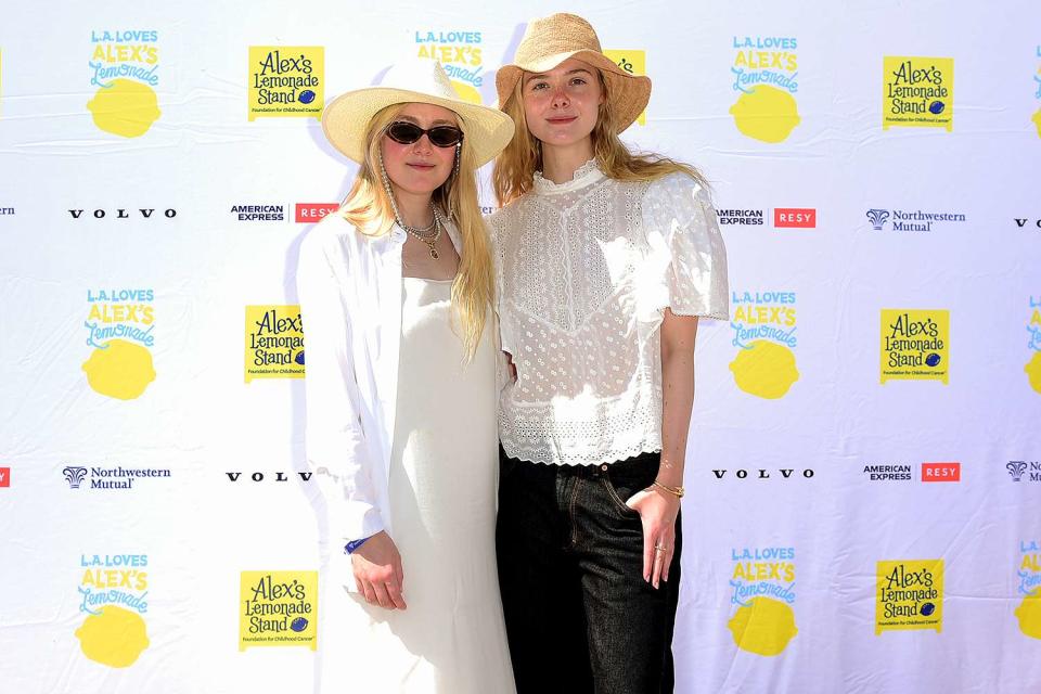 <p>Vivien Killilea/Getty Images</p> Dakota and Elle Fanning at LA Loves Alex