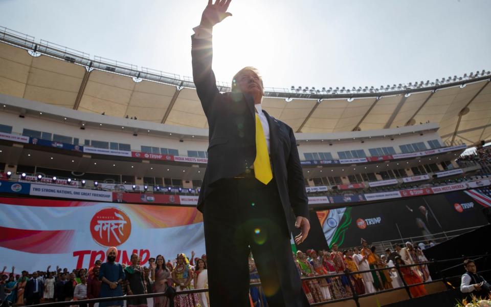 US President Donald Trump waves as he departs after a "Namaste Trump," event at Sardar Patel Stadium - AP