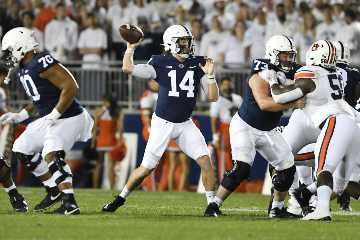 Penn State quarterback Sean Clifford (14) passes during an NCAA college football game against Auburn in State College, Pa., on Saturday, Sept. 18, 2021. (AP Photo/Barry Reeger)