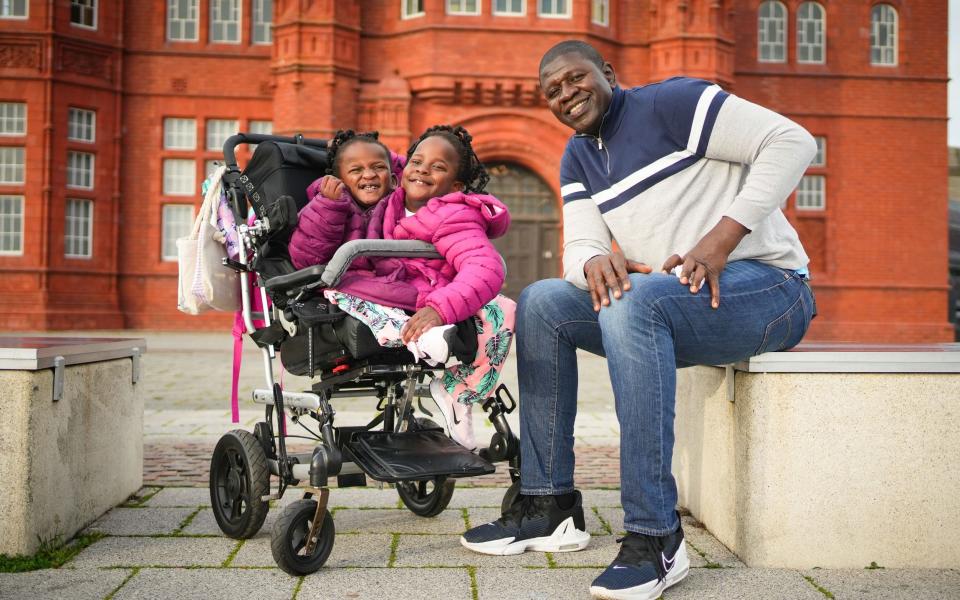 Marieme and Ndeye with their father Ibrahima