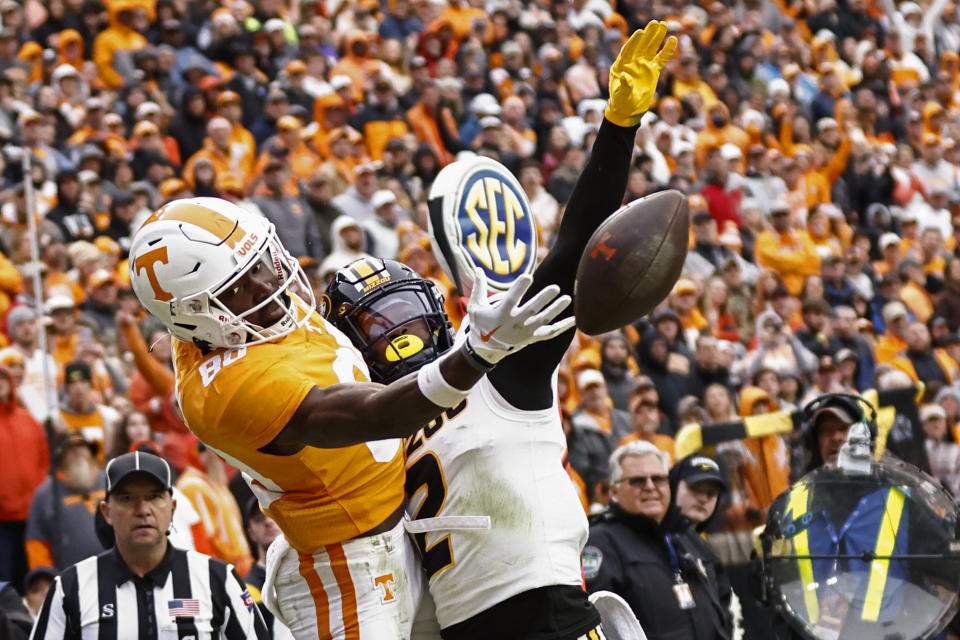 Tennessee wide receiver Ramel Keyton (80) tries to make a catch as he's defended by Missouri defensive back Ennis Rakestraw Jr. (2) during the second half of an NCAA college football game Saturday, Nov. 12, 2022, in Knoxville, Tenn. Rakestraw Jr. was called for pass interference on the play. (AP Photo/Wade Payne)